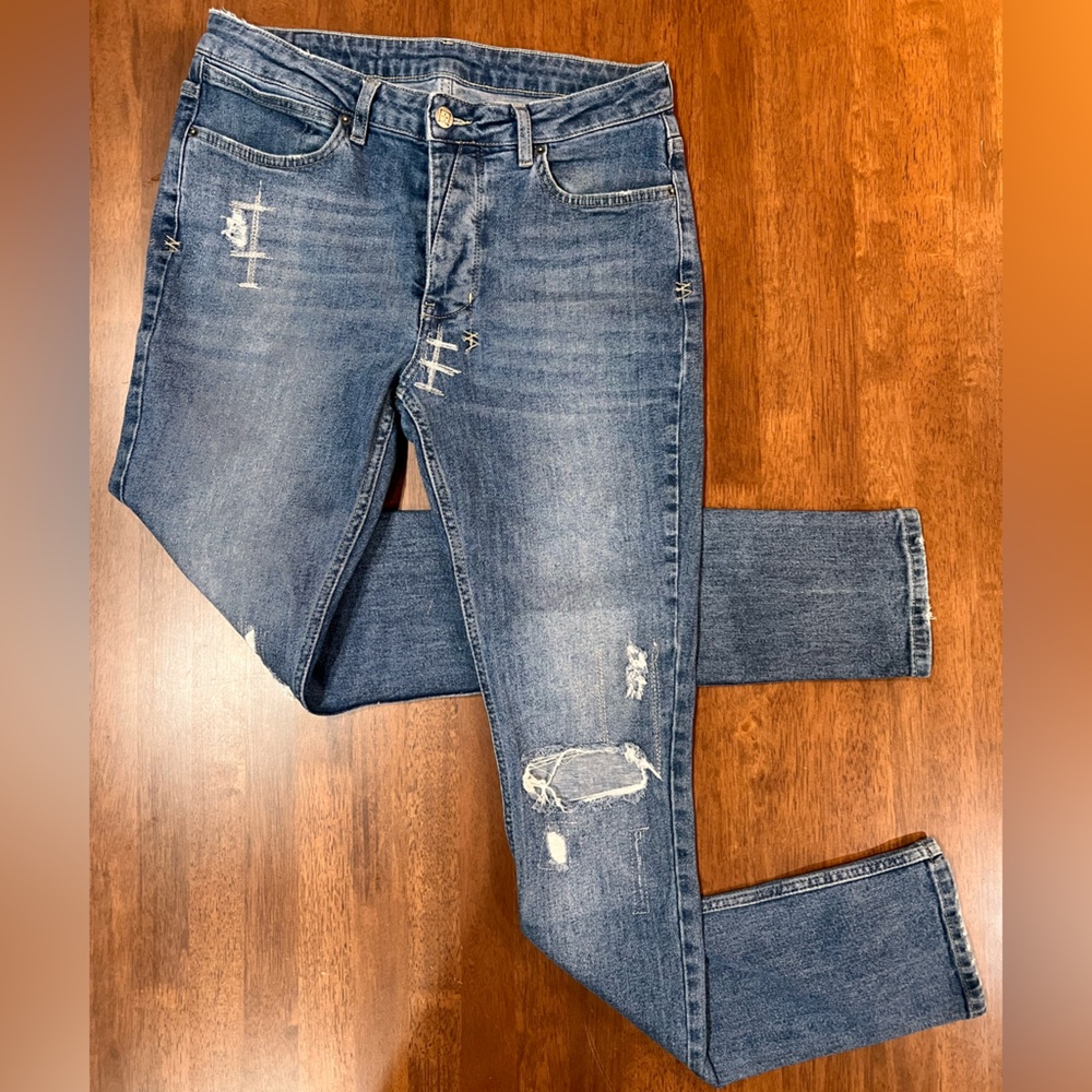 KSUBI MENS R/N 150730 SKINNY JEANS IN MEDIUM WASH. SIZE 32”